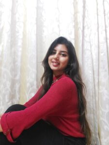 Ritu Biswas styling high neck red sweater in her fashion and lifestyle blog