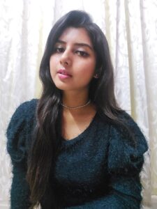 Ritu Biswas styling puff sleeve sweater top in her fashion and lifestyle blog