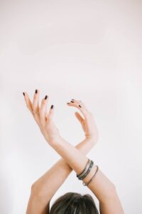 girl wearing dainty bracelets in a blog post of 9 must have jewelry for everyday wear
