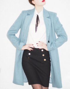 Woman wearing pastel blue blazer with white shirt in fashion and lifestyle blog by Ritu Biswas with the topic 11 summer fashion trends that are easy to follow