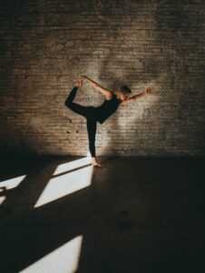 woman exercising in black workout clothes in the blog Why Self-Care Is Important And 6 Habits To Implement For A Healthy Lifestyle by Ritu Biswas