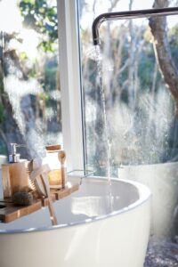 aesthetic bathtub setup for skincare and pampering session in the blog Why Self-Care Is Important And 6 Habits To Implement For A Healthy Lifestyle by Ritu Biswas