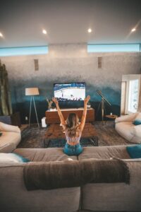 woman watching movie or series in the blog Why Self-Care Is Important And 6 Habits To Implement For A Healthy Lifestyle by Ritu Biswas