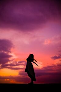 woman feeling liberated healing physical conditions in the blog Why Self-Care Is Important And 6 Habits To Implement For A Healthy Lifestyle by Ritu Biswas